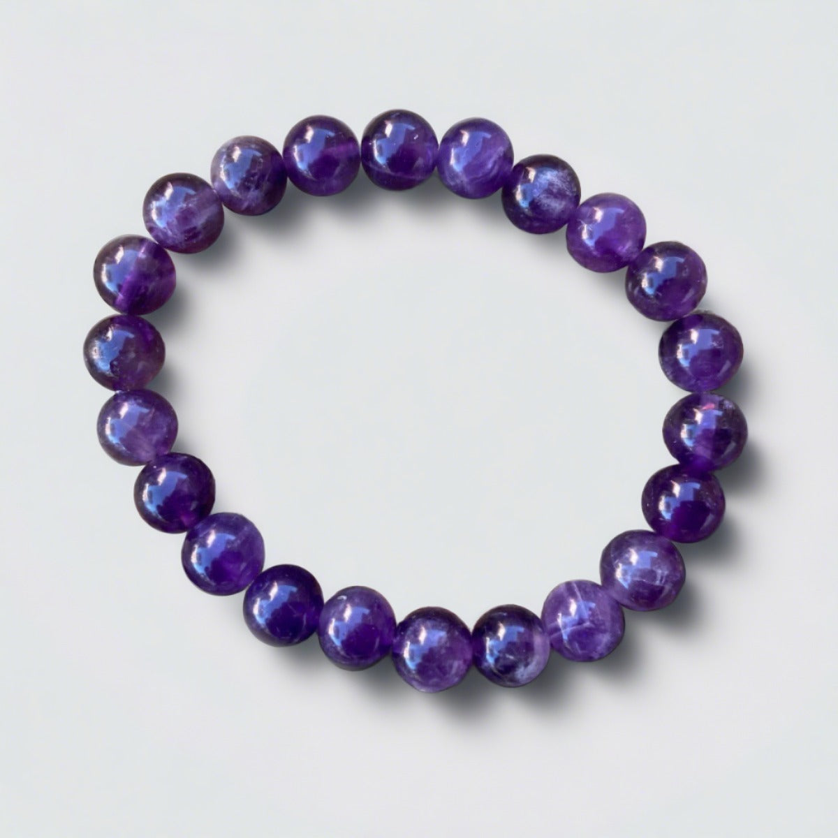 A stretch cord bracelet featuring deep purple amethyst gemstones