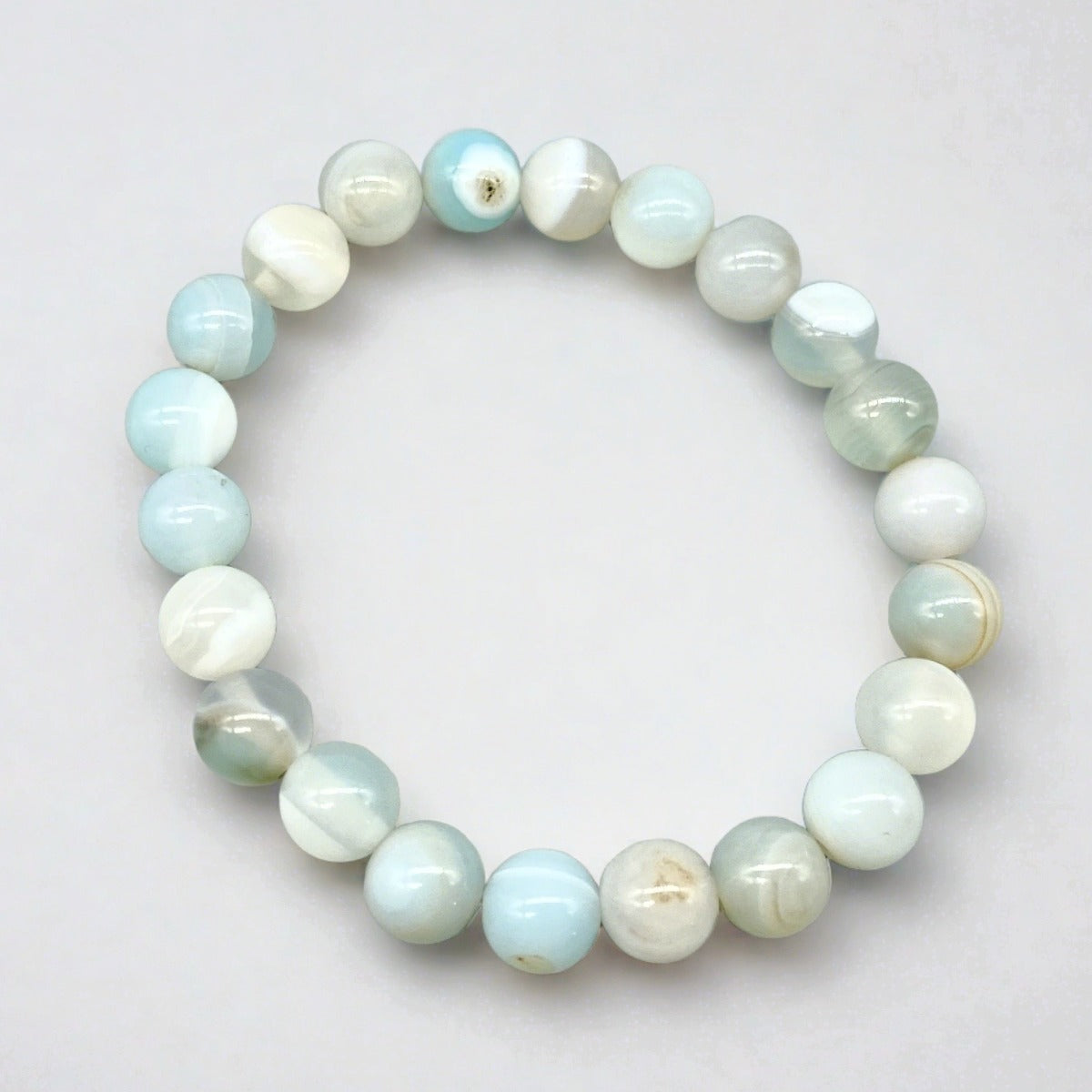 Stretch cord bracelet featuring arctic blue agate gemstones