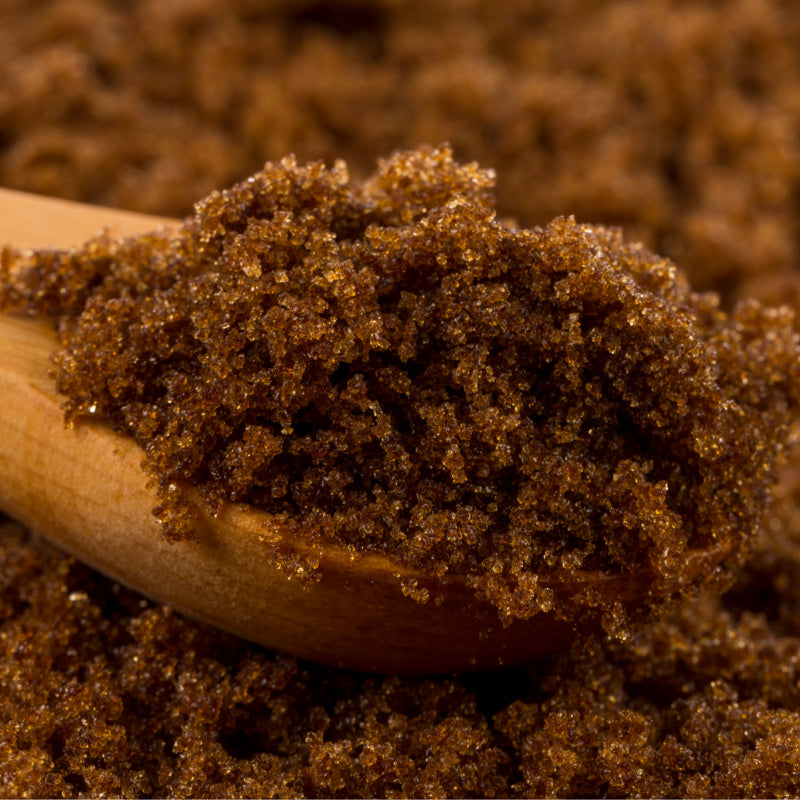  Closeup of brown sugar in wooden spoon