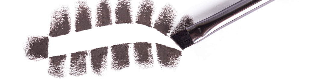 Close-up of a natural eyebrow filler with brow filler brush on a white background.