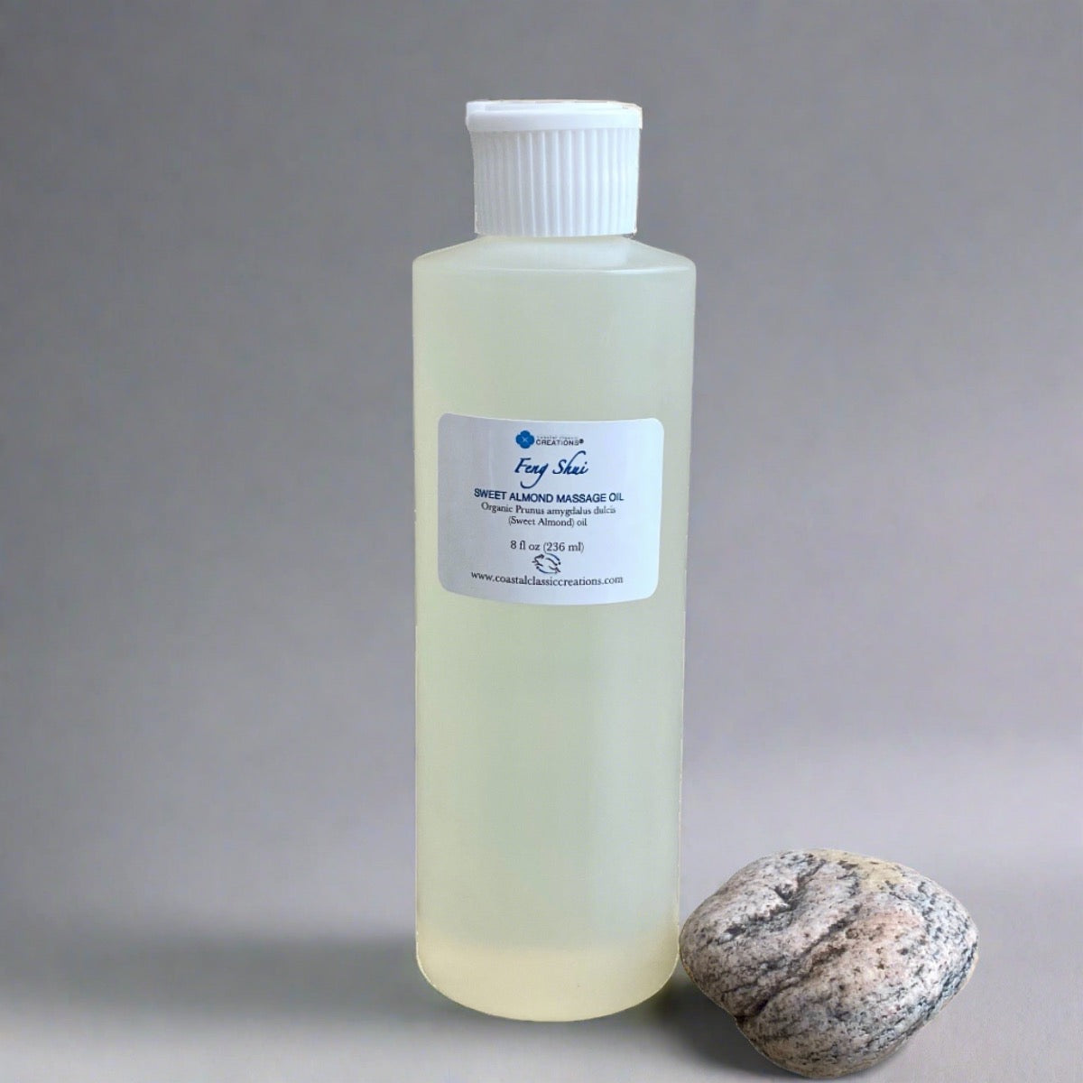 8 oz bottle of sweet almond oil with a white flip cap labeled with the product name and ingredients, featuring a sleek, cylindrical shape