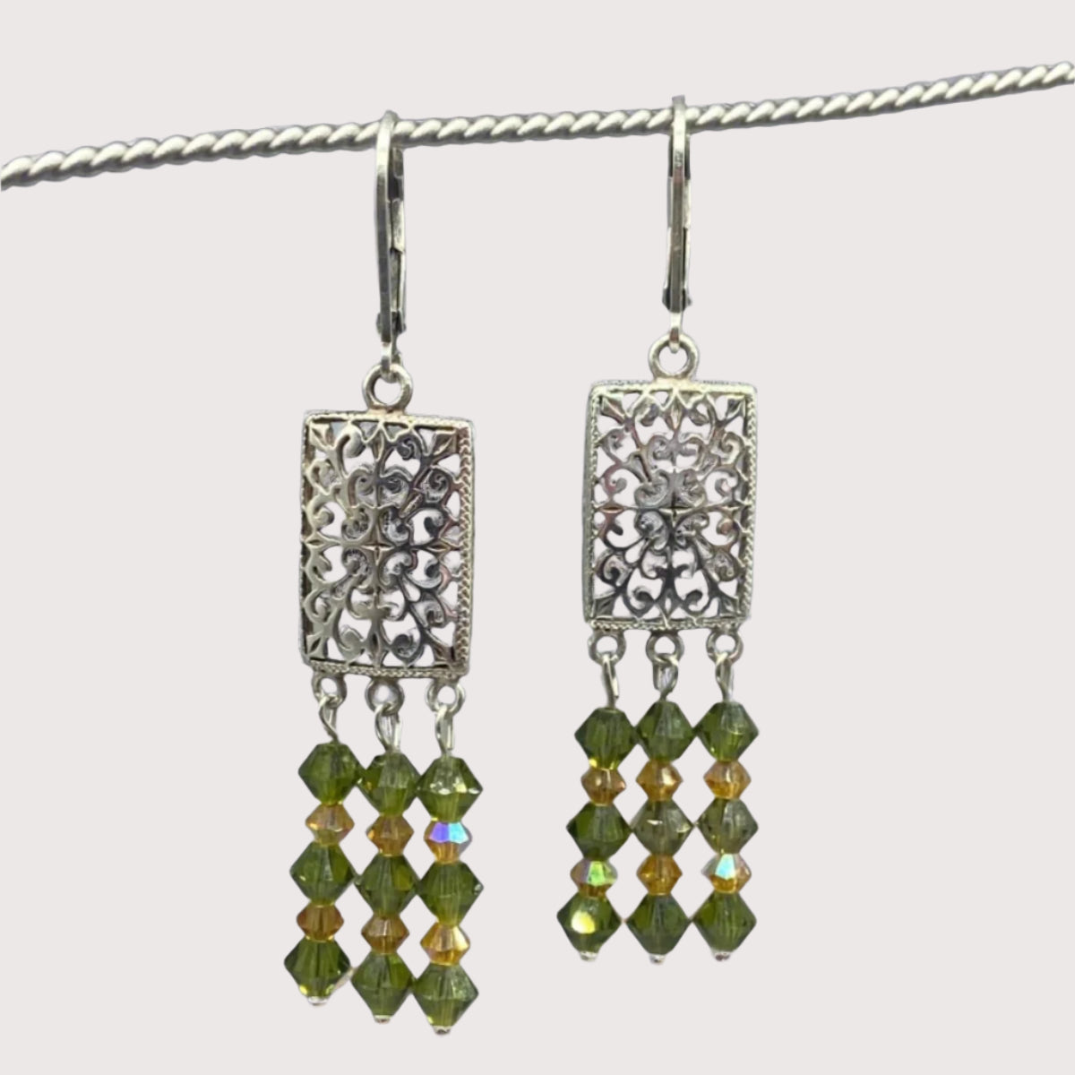 A pair of exquisite Aquatic Flowers Olivine Crystal Chandelier Earrings, featuring shimmering crystals 