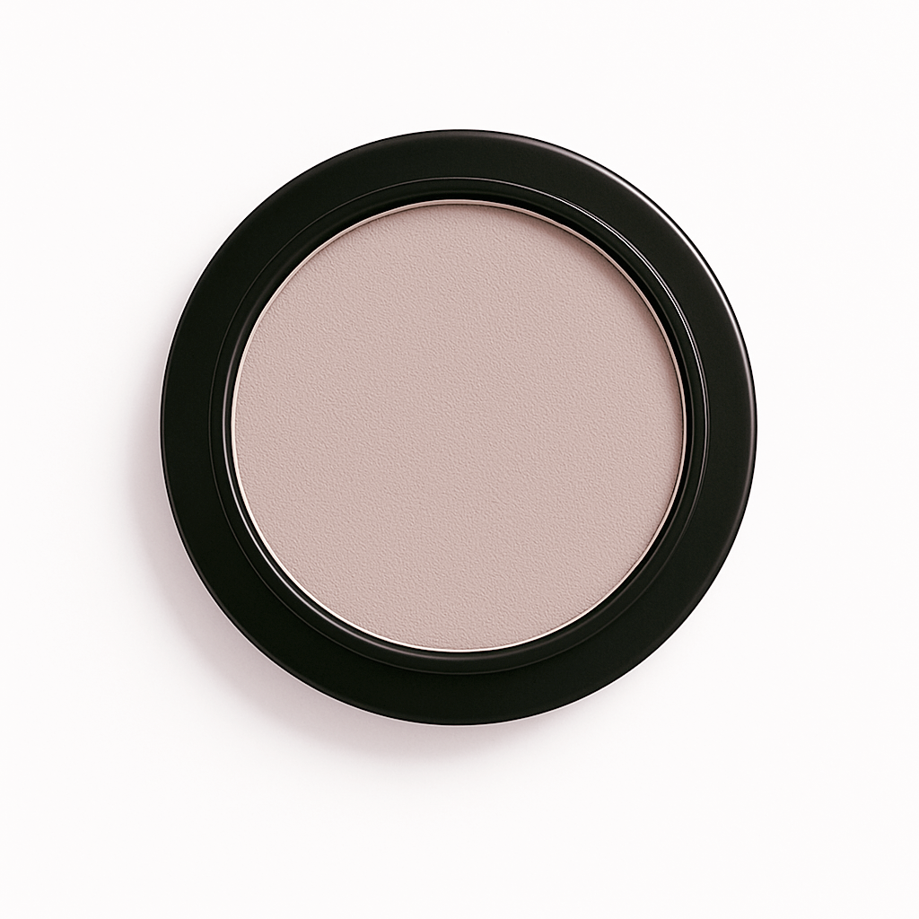 Round pan of pearlly grey taupe matte eyeshadow in a black compact, displayed on a clean white background
