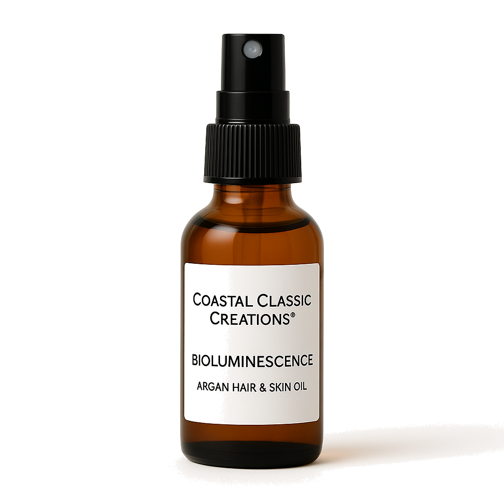Amber spray bottle with black ribbed cap and white label reading 'Bioluminescence Argan Hair & Skin Oil' on white background