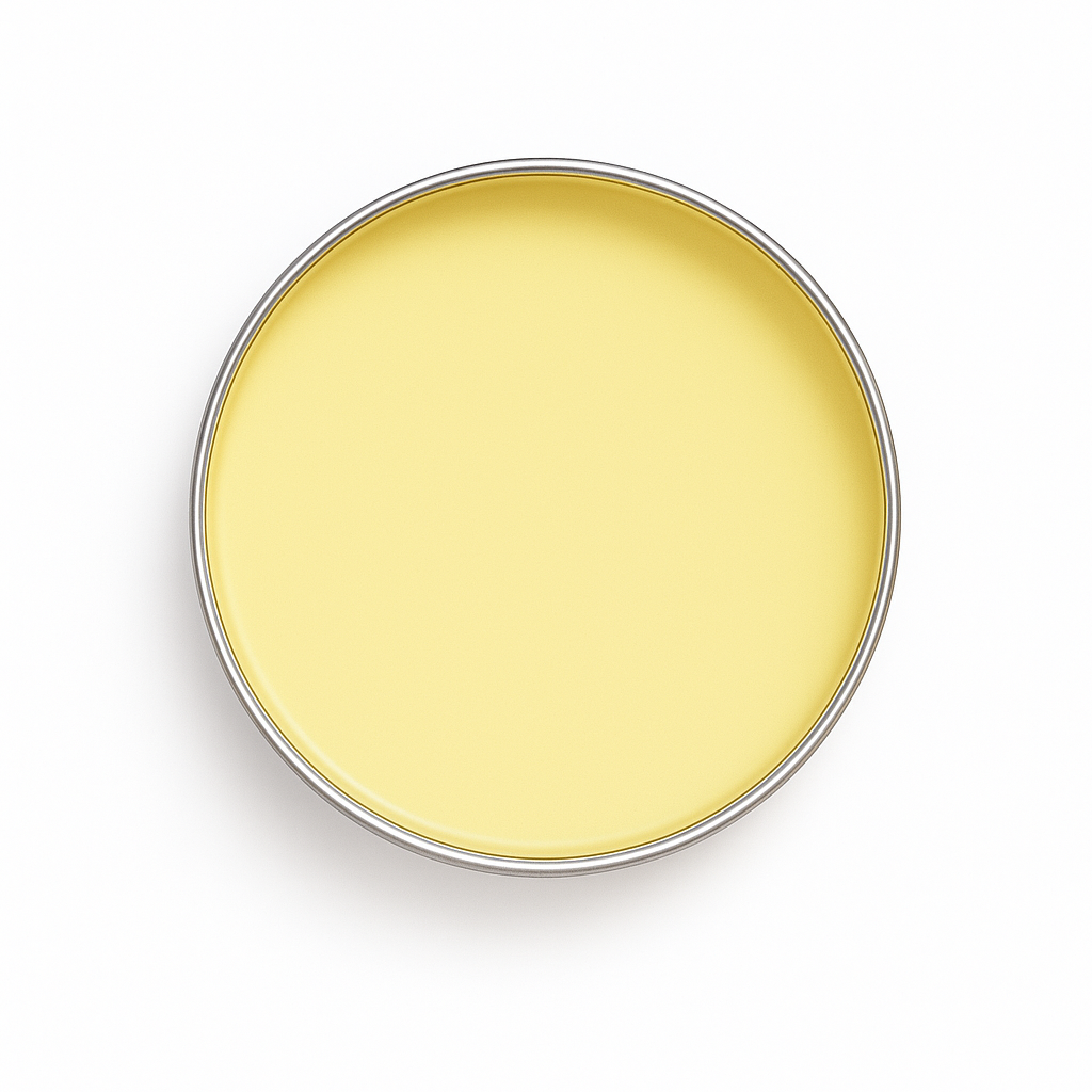 Top-down view of Drift Current Hand & Joint Balm in open tin with smooth pale yellow balm, shown on a white background