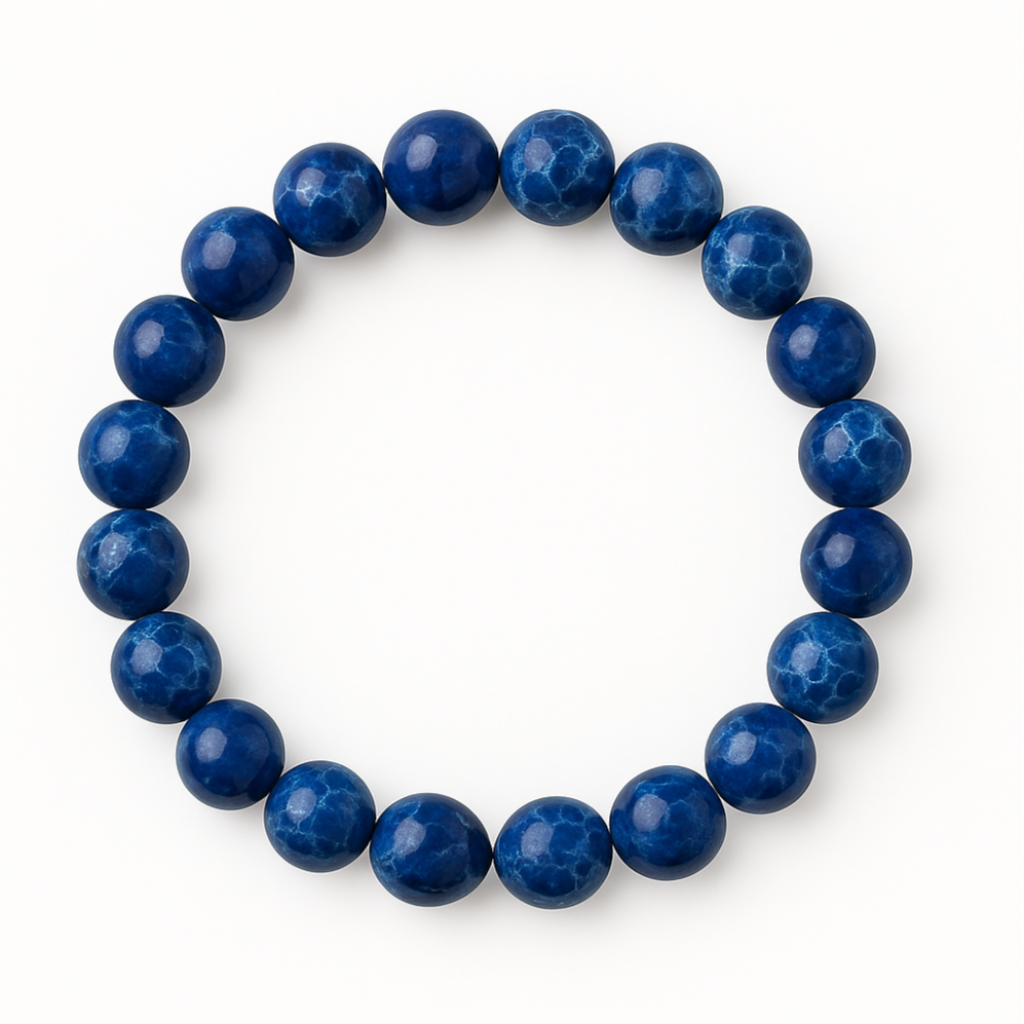 Circular stretch bracelet with polished midnight blue impression jasper beads featuring marbled patterns on white background