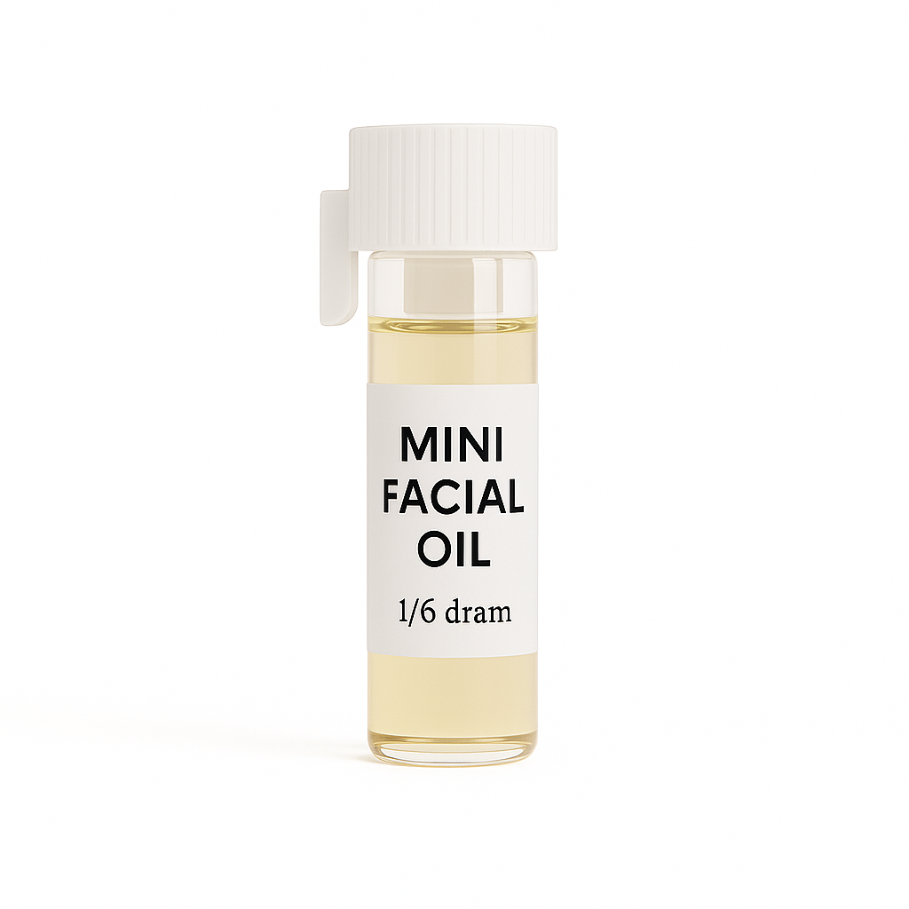 Mini Facial Oil in clear 1/6 dram vial with white label and ribbed cap, shown on a pure white background