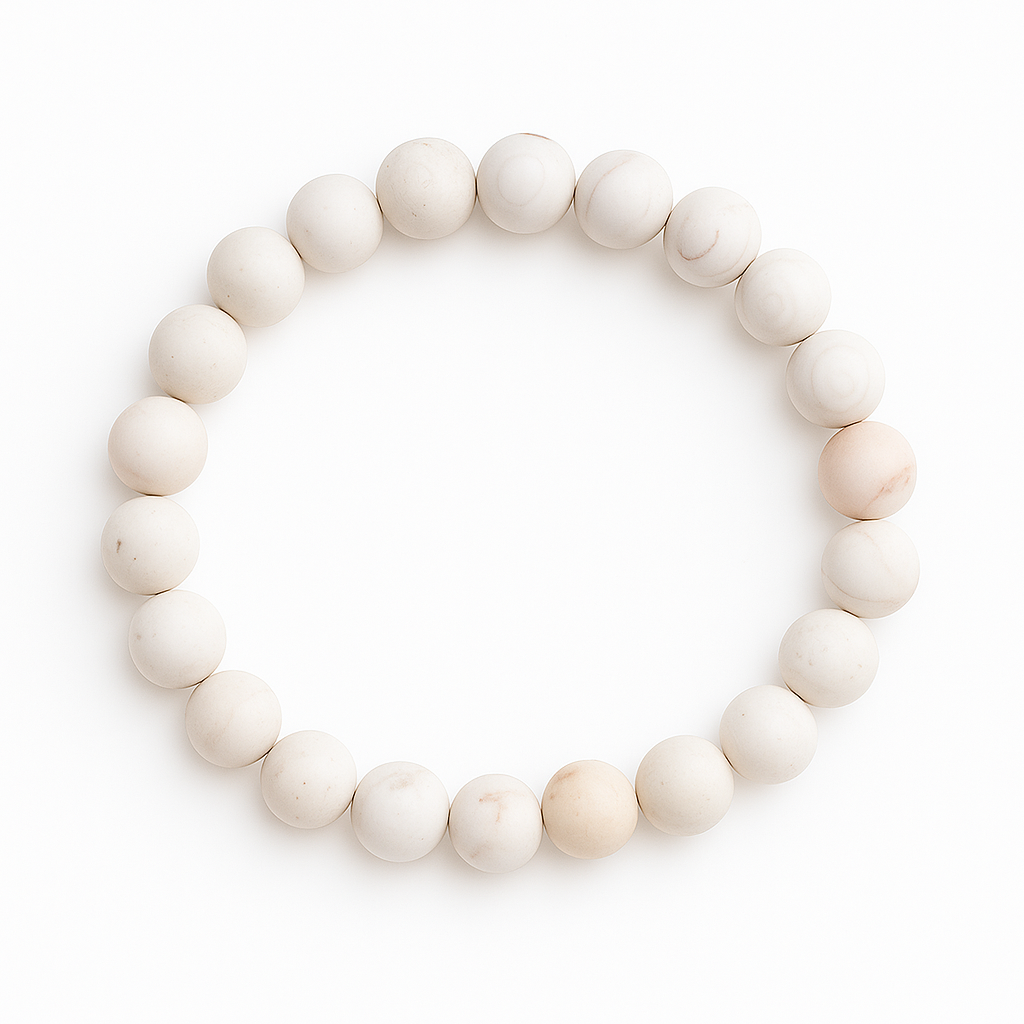 Stretch bracelet with 8mm Ocean Blossom Agate beads in cream tones and matte finish, arranged in a circle on white background
