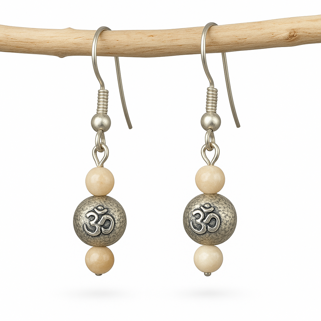 Silver plated dangle earrings with Om bead and beige agate accents, shown on French hooks and wood dowel against a white background