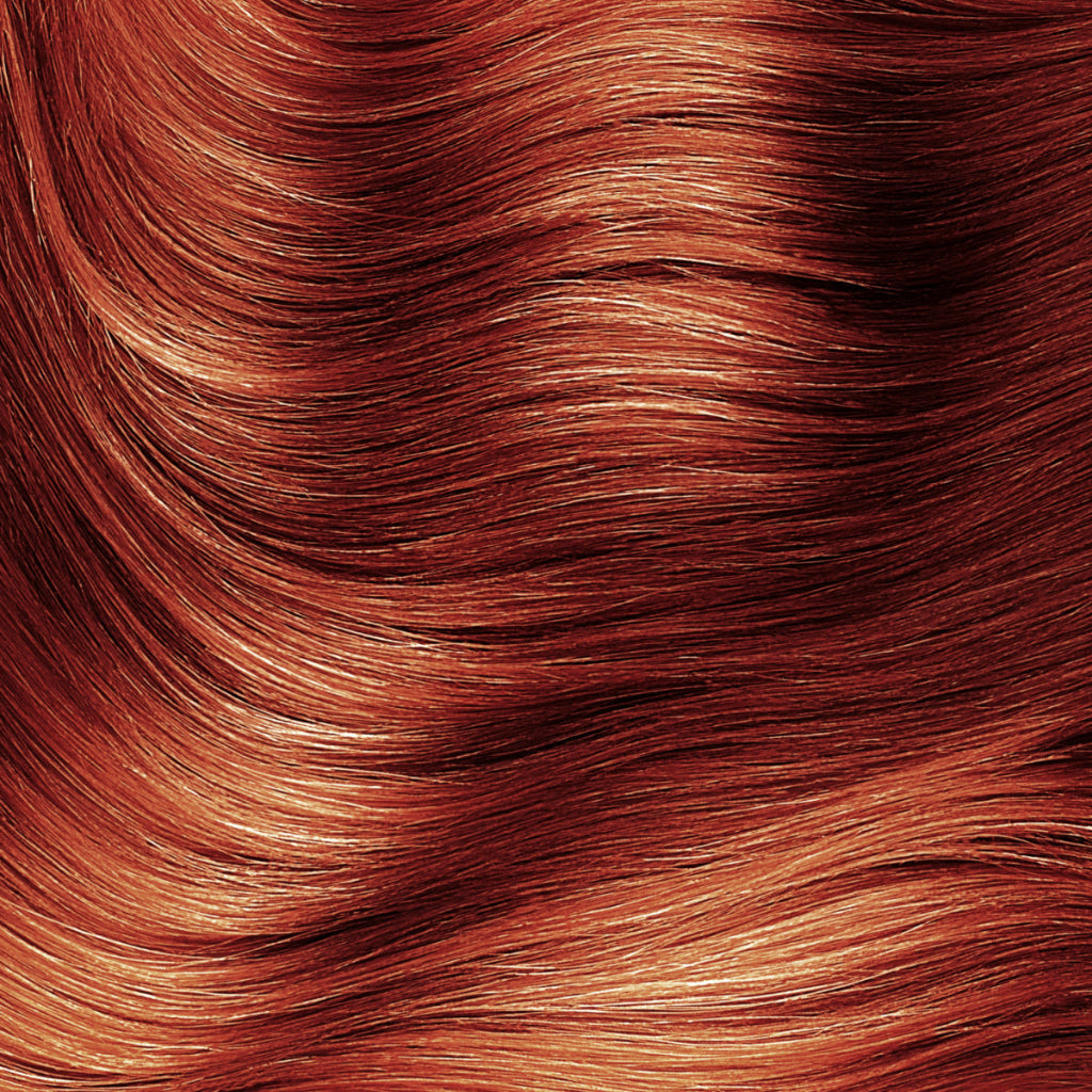 Swatch of red henna-colored hair showing rich red tones 