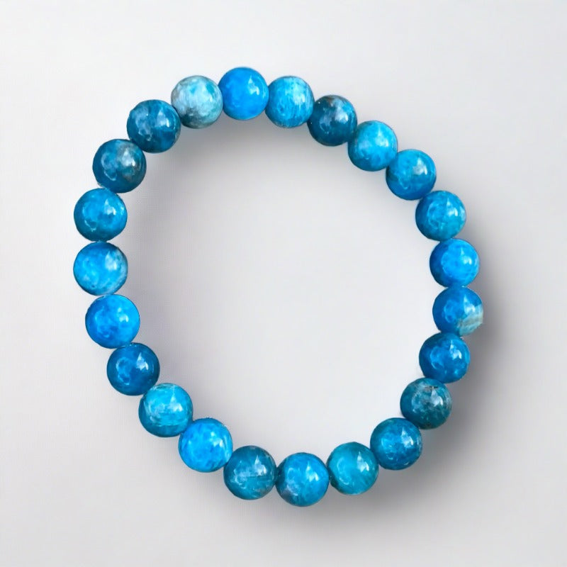 Pacific blue apatite bracelet on rock background