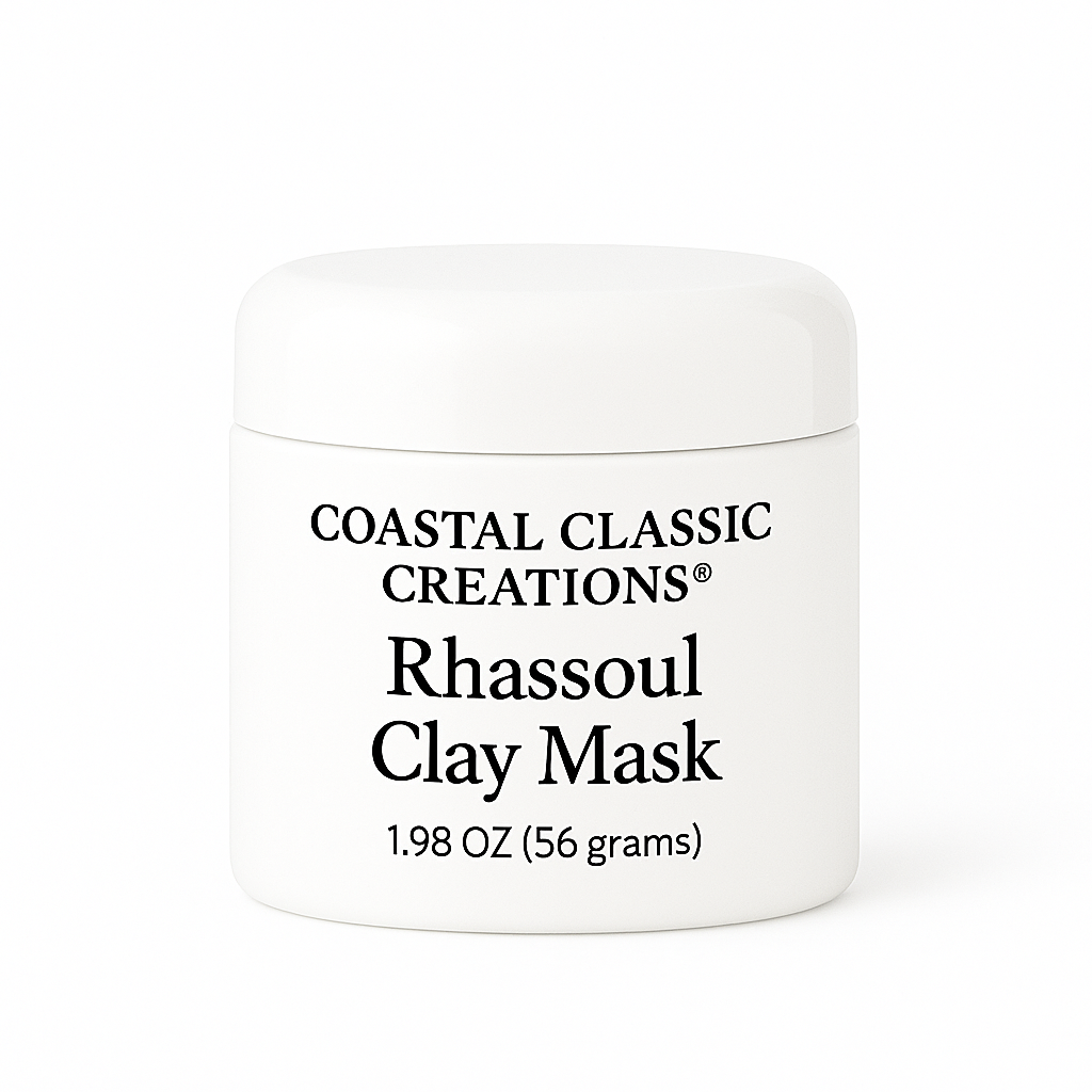 White plastic jar labeled "Coastal Classic Creations® Rhassoul Clay Mask – 1.98 oz (56 grams)," shown on a pure white background