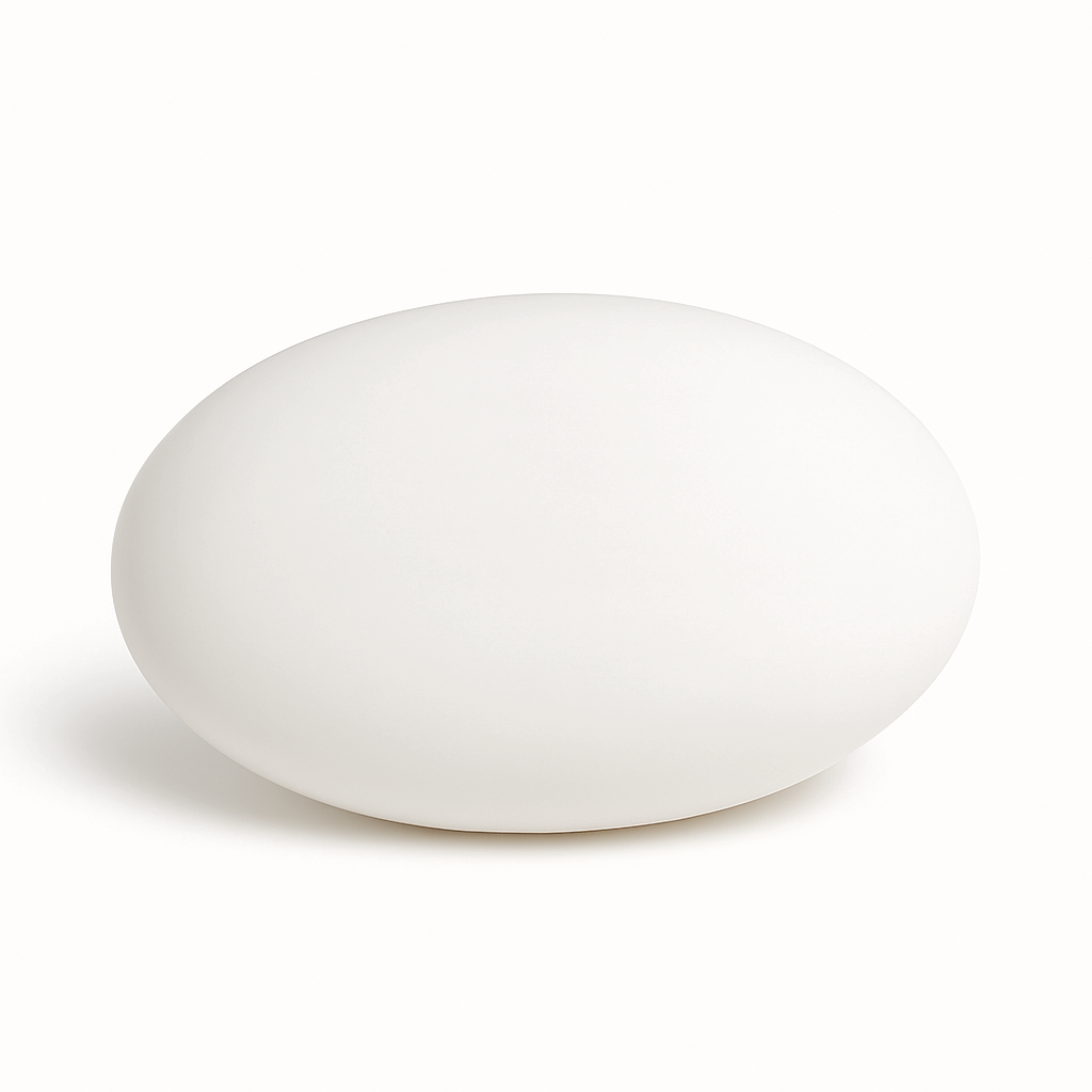 Oval white shea butter soap bar with a smooth matte finish, minimalist design, displayed on a clean white background
