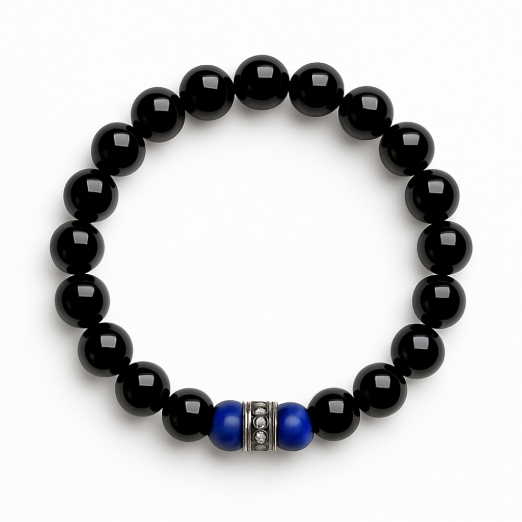Black onyx stretch bracelet with matte navy lapis beads and silver spacer, arranged in a circle on a white background