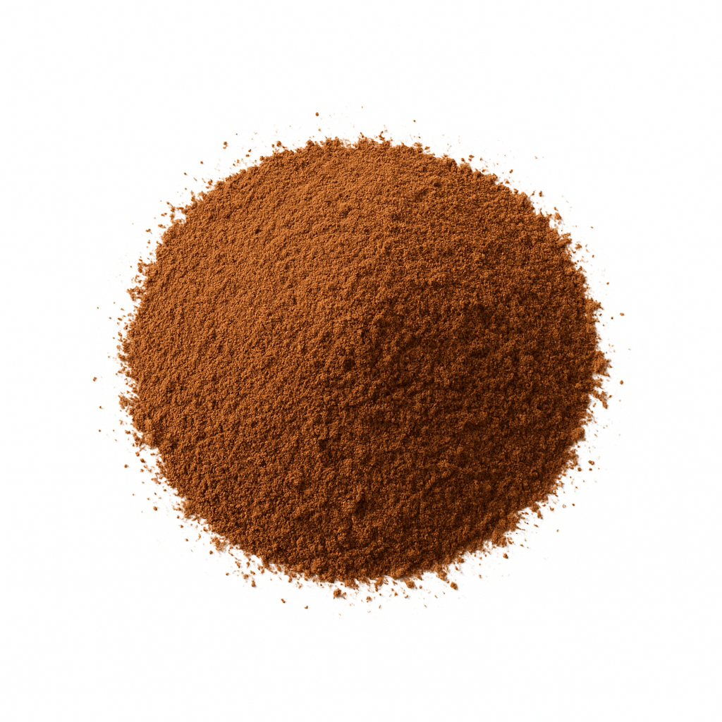 Finely ground mound of clove powder on a pure white background