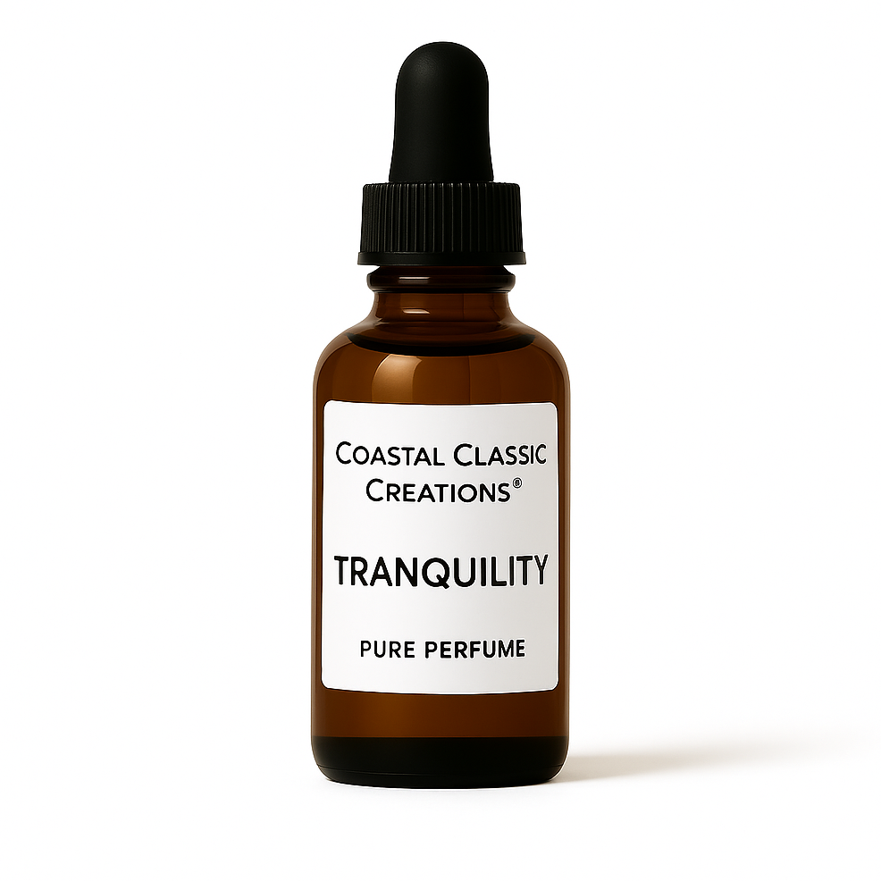 Bottle of Tranquility Pure Perfume with a bright white label and gold cap, featuring a sweet, spicy floral ylang ylang blend