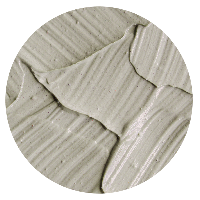 Smooth wet clay in shades of earthy brown and gray, freshly shaped and glistening with moisture