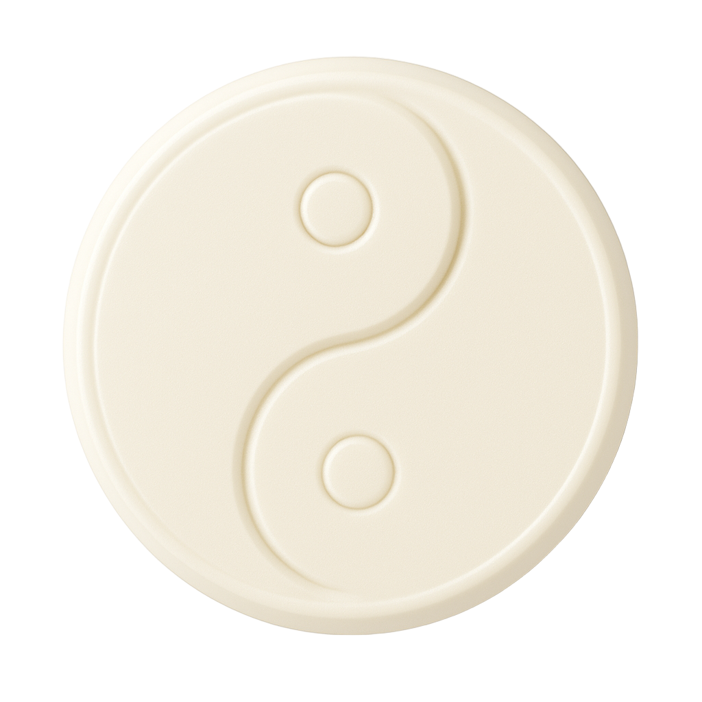 Round ivory shea butter soap bar embossed with a yin yang design, displayed on a clean white background
