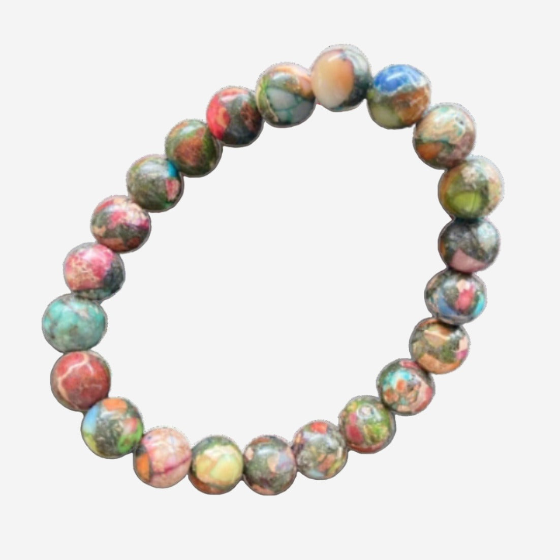 Mardi Gras Impression Jasper & Pyrite Happiness Bracelet with vibrant 8mm gemstones on rock background