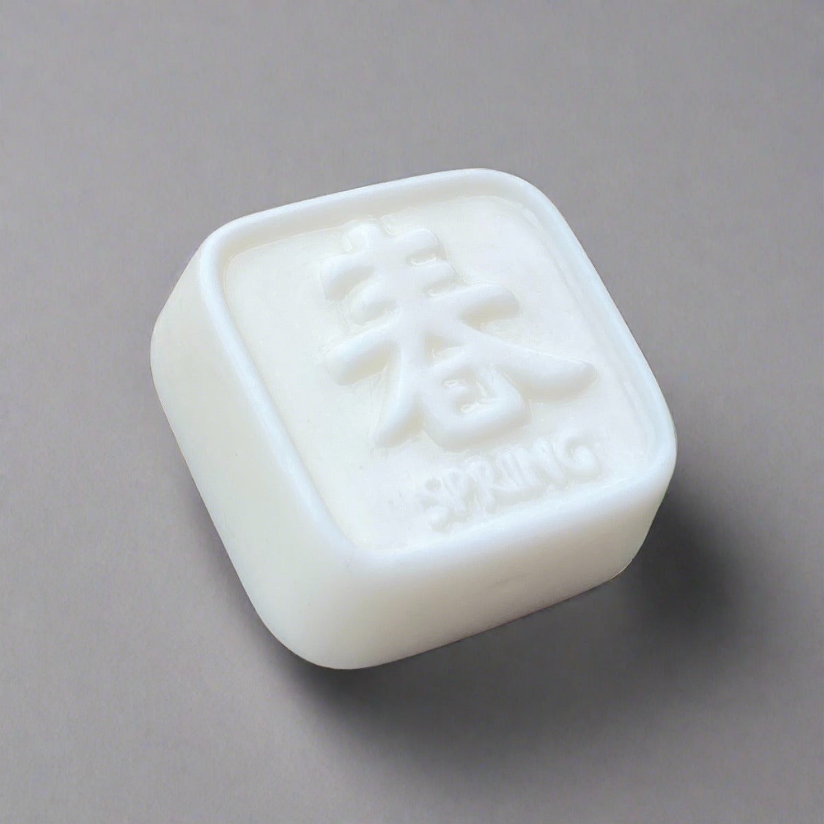 Bar of white soap with beautiful Chinese symbols meaning "spring" design