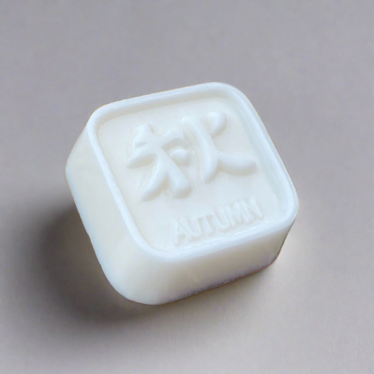 Bar of white soap with beautiful Chinese symbols meaning "autumn" design 