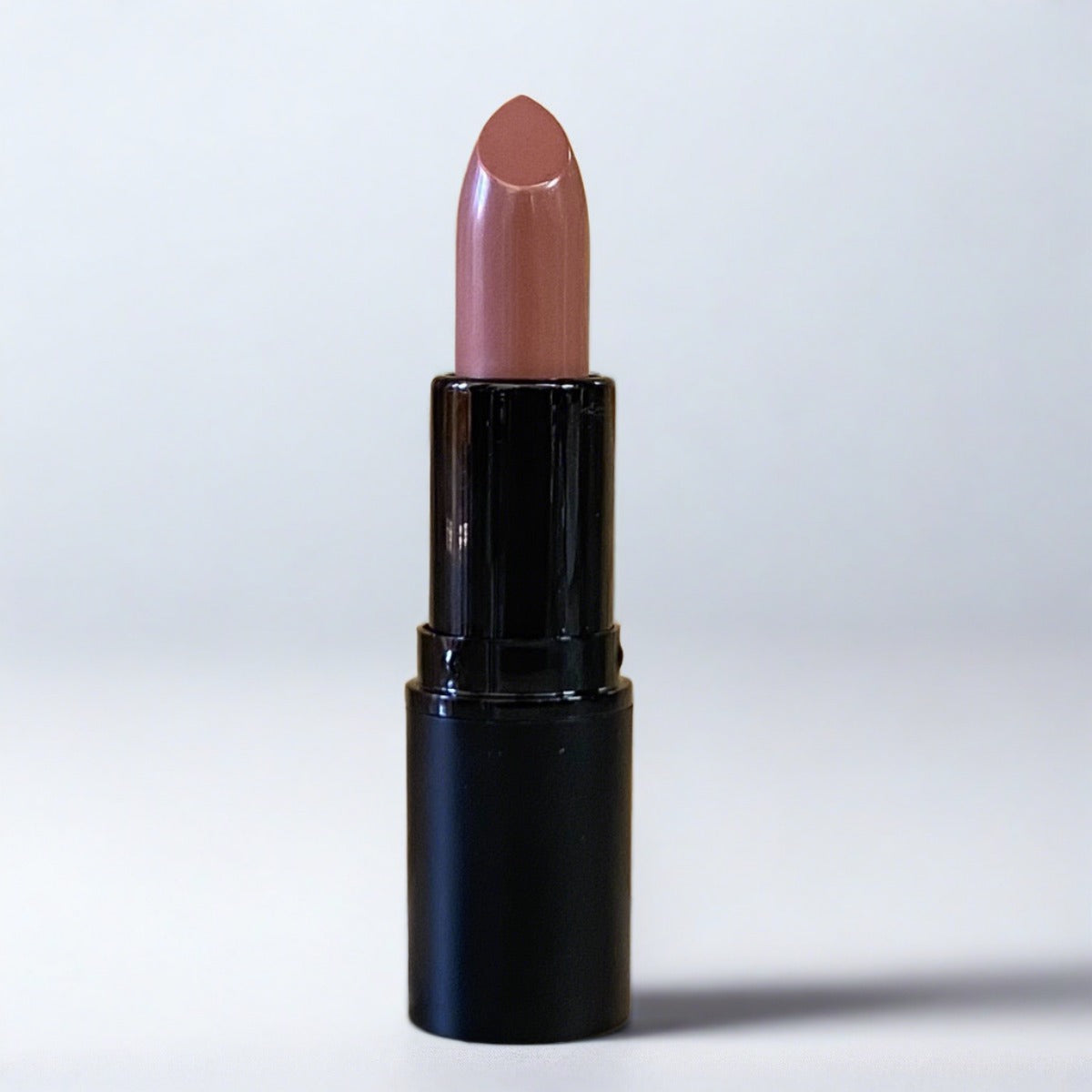 Swatch of Tranquil Lipstick, a misty mauve, barely there color