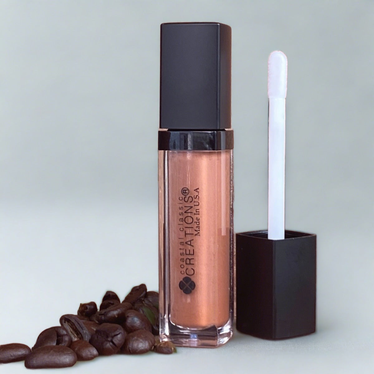 Tube of warm spice and cooper lipgloss with applicator