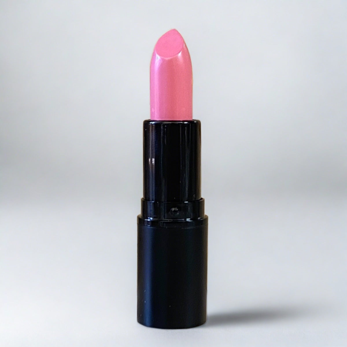 Creamy, matte finish, bright pink lipstick