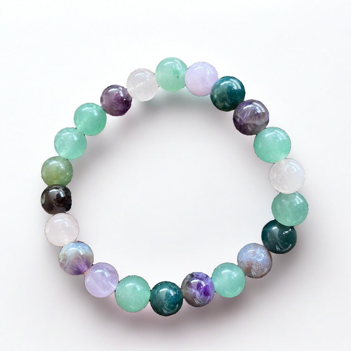 Multi-colored Calming Meditation Mala Bracelet On rock background