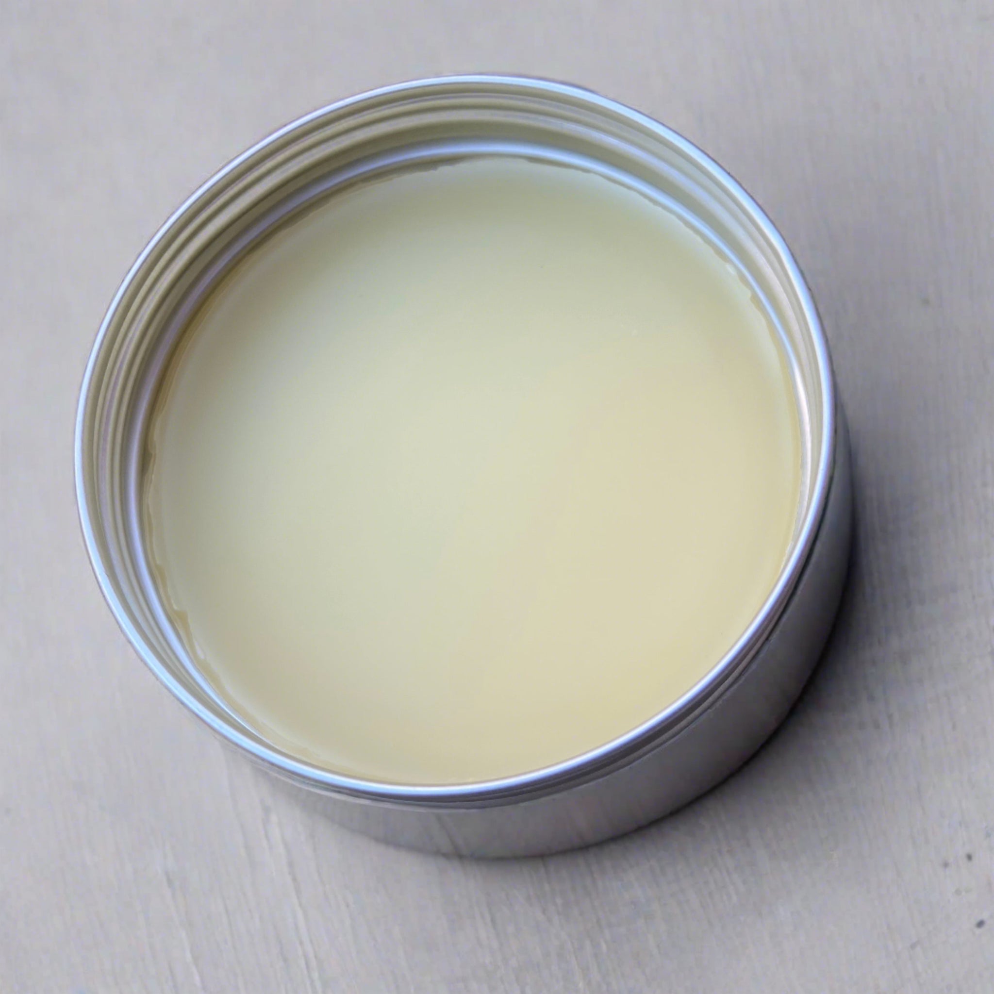 Natural hand balm on rock background