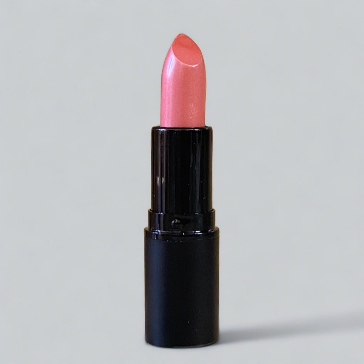 Bashful Lipstick - A charming pink coral shade, epitomizing comfort and style for a chic and effortless look