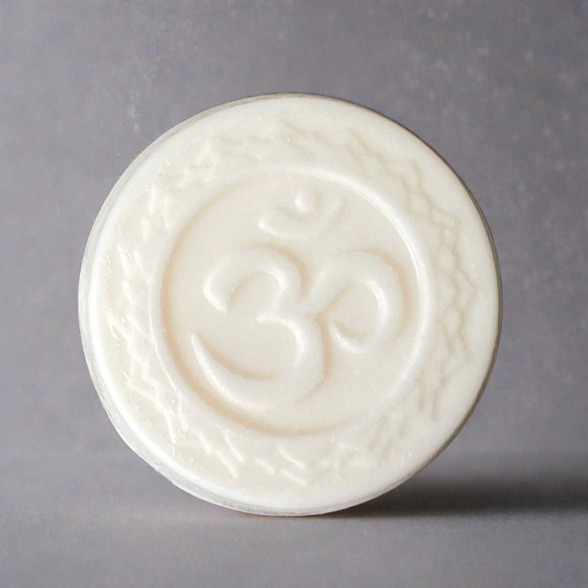 Om Patchouli & Shea butter soap with meditation sticks on rock background