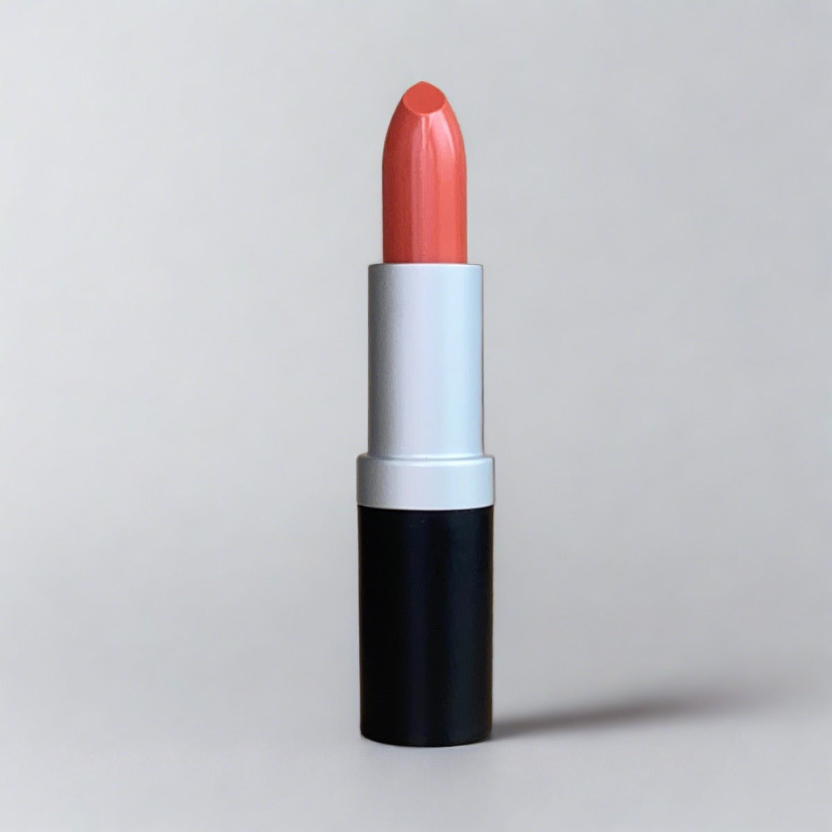 Vibrant coral lipstick for a pop of color
