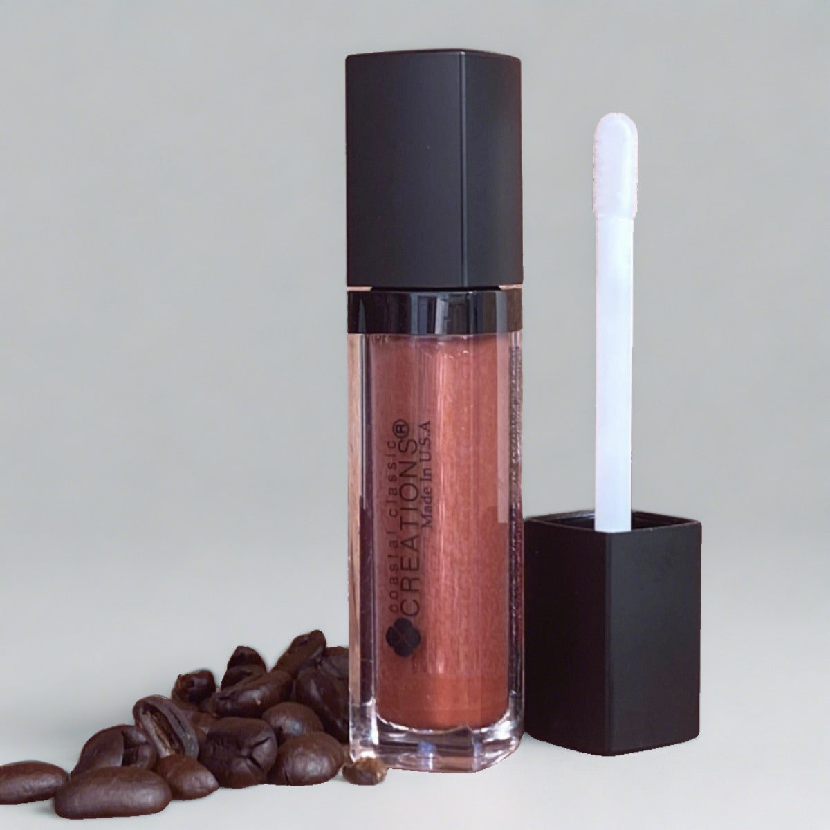 High coverage reddish brown hemp lip gloss with coffee beans