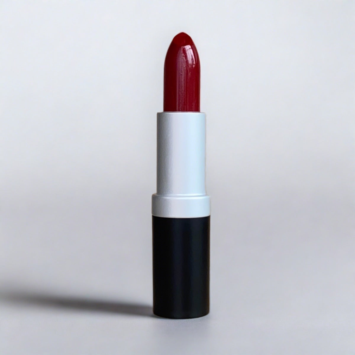 Venetian Red Lipstick, a classic burgundy red with brown undertones