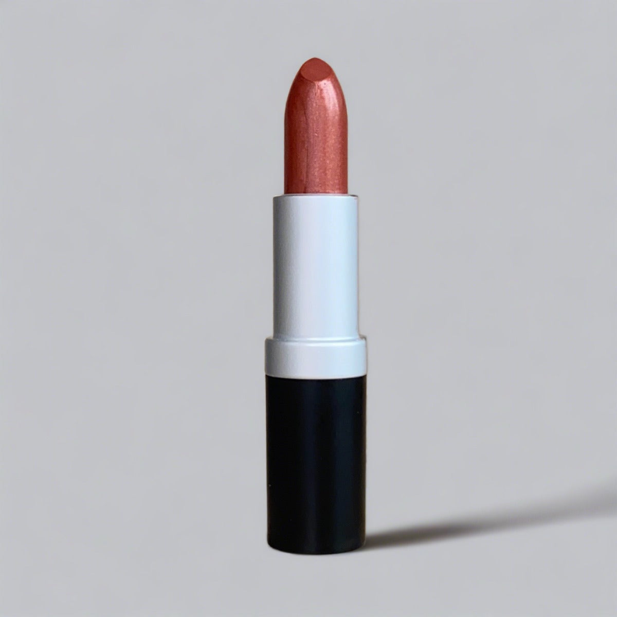 Warm spice colored copper lipstick with hydration