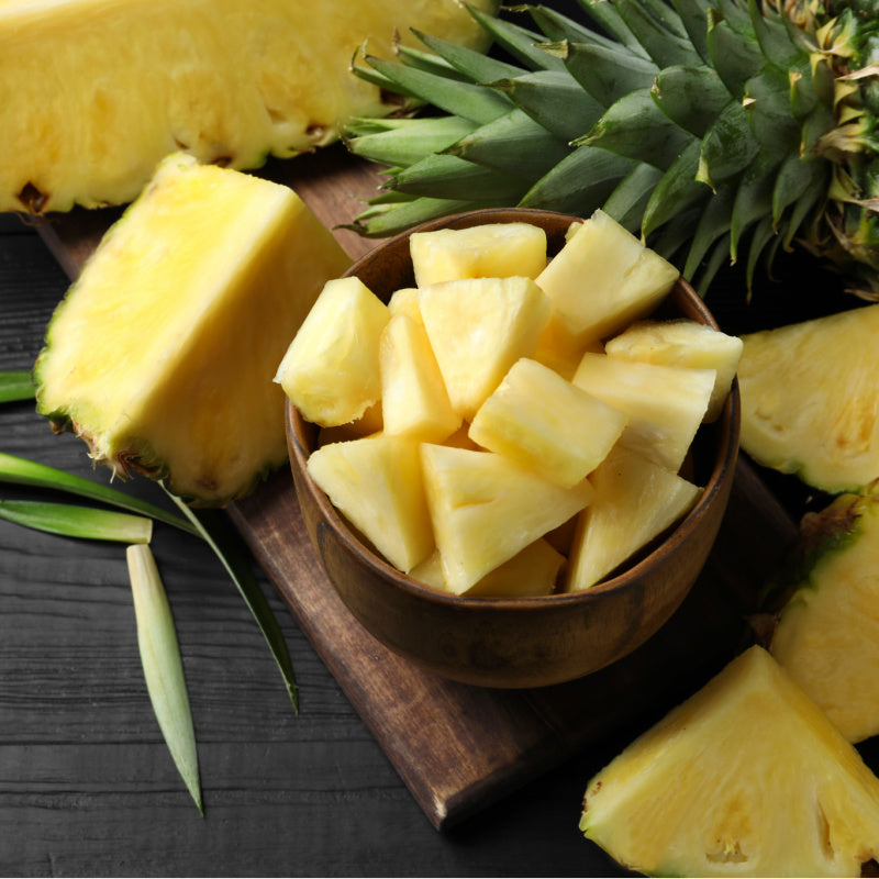 Bowl of pineapple chunks representing product fragrance