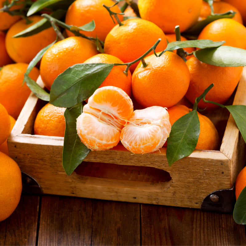Basket of tangerines representing product fragrance